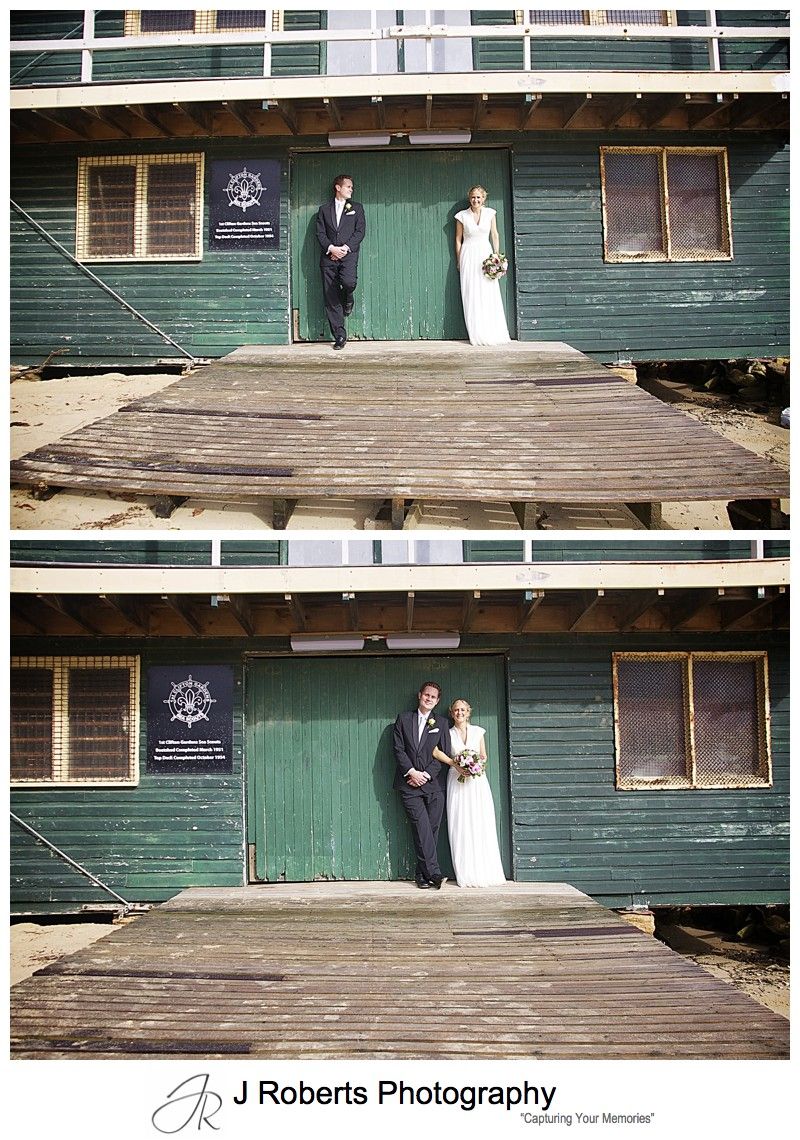 Couple leaning on wooden doors at 1st Clifton Gardens Sea Scout Hall - wedding photography sydney